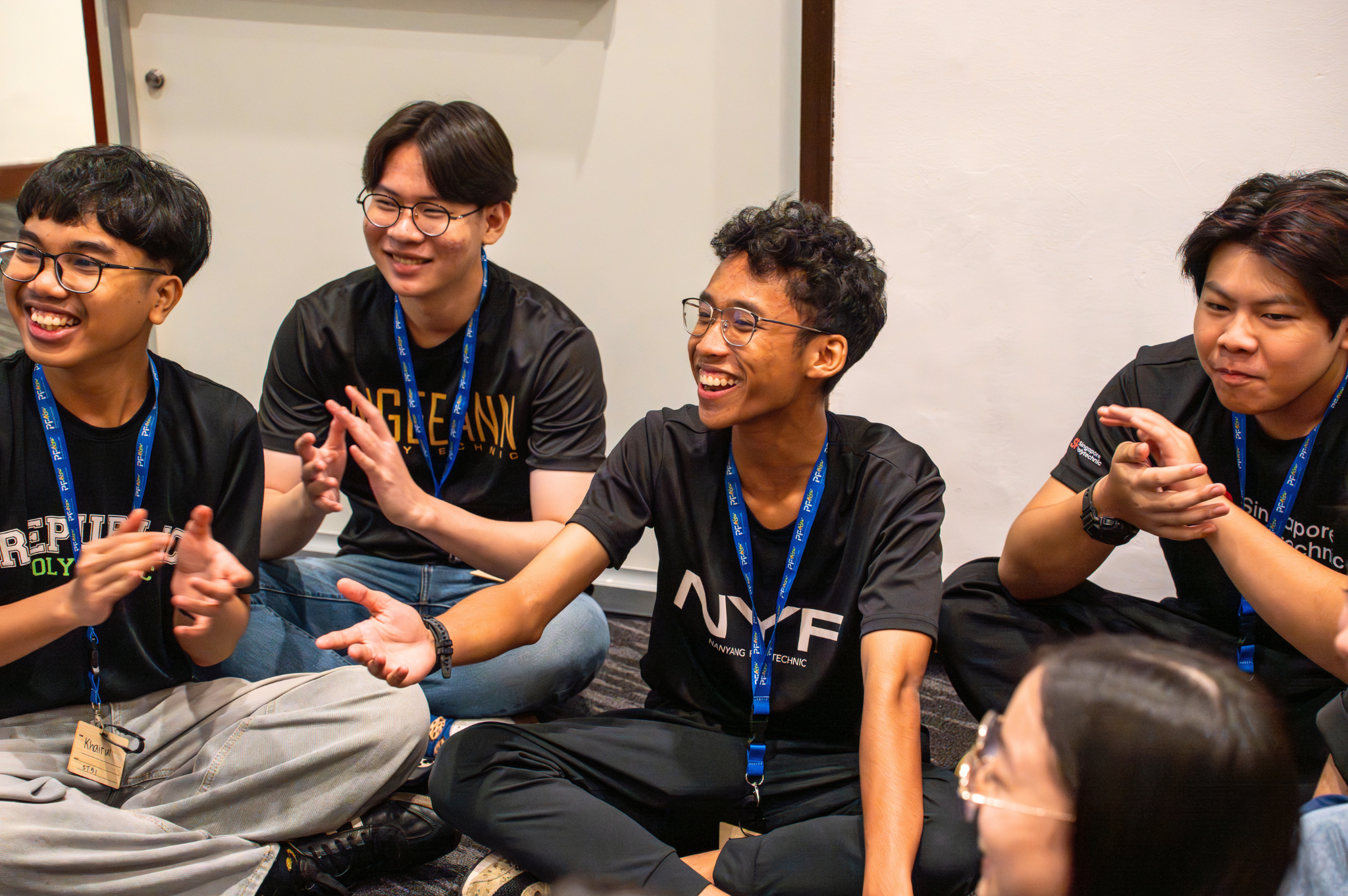 Student delegates engaging in their first sub-theme discussion, sharing perspectives and ideas in small groups.